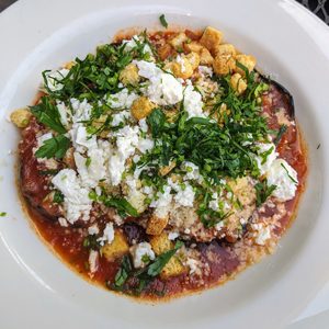 Eggplant appetizer with feta, herbs and tomato sauce