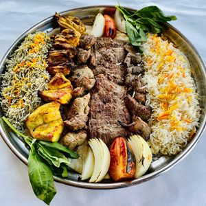 Persian kabob combination platter with saffron rice and grilled vegetables