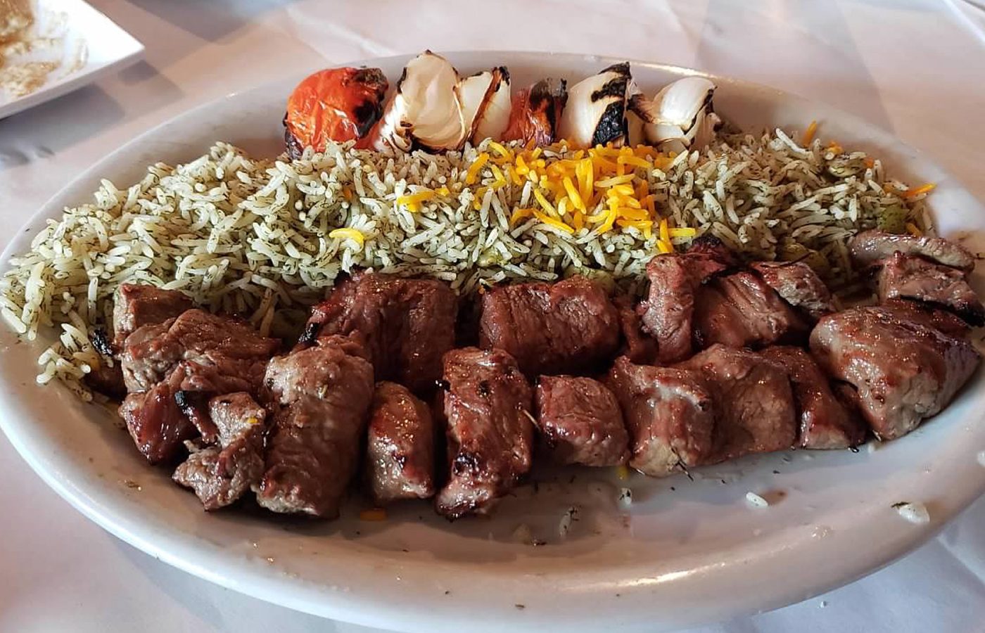Beef kabobs over saffron and dill rice at Reza's Restaurant in Evanston